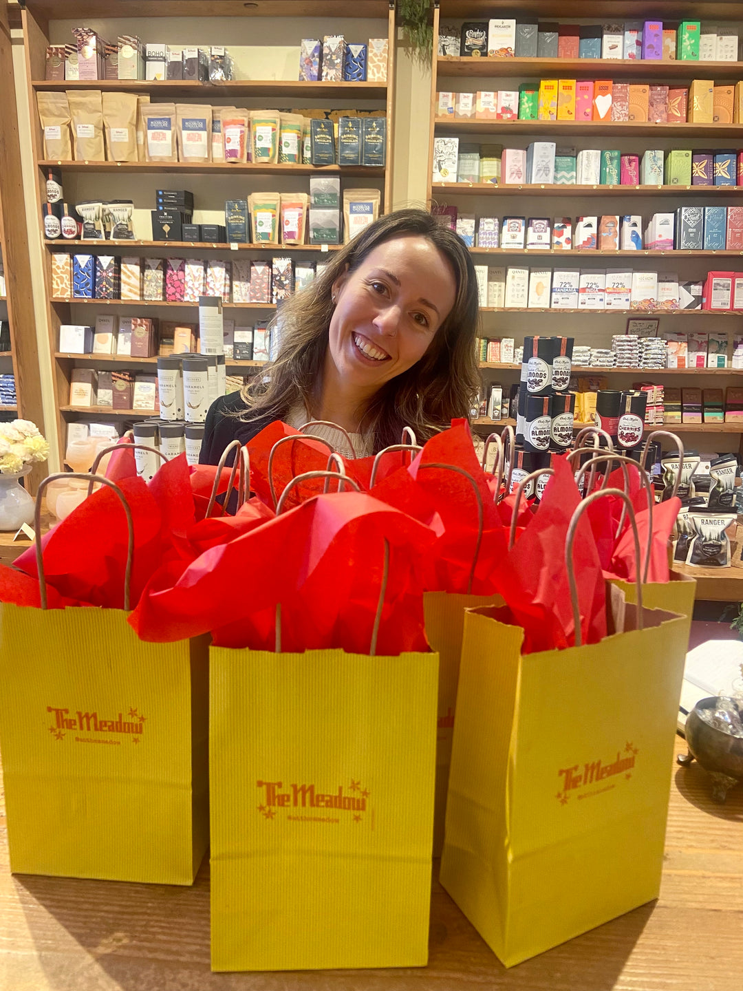 Customer with shopping yellow meadow bags at The Meadow NW 23rd