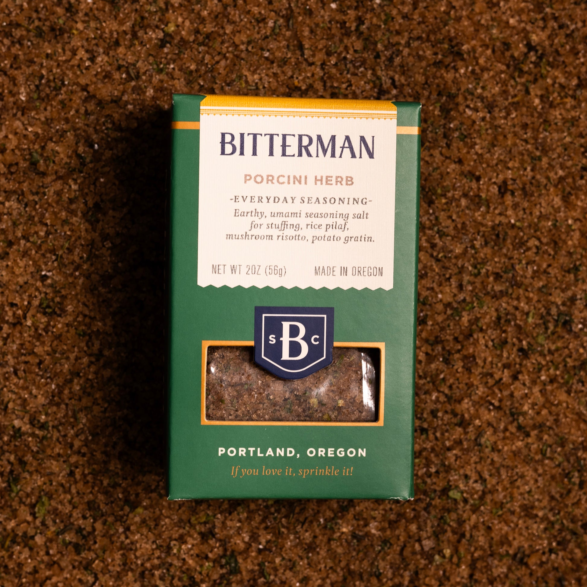 Bitterman Porcini Herb seasoning salt in a green box on a bed of porcini salt