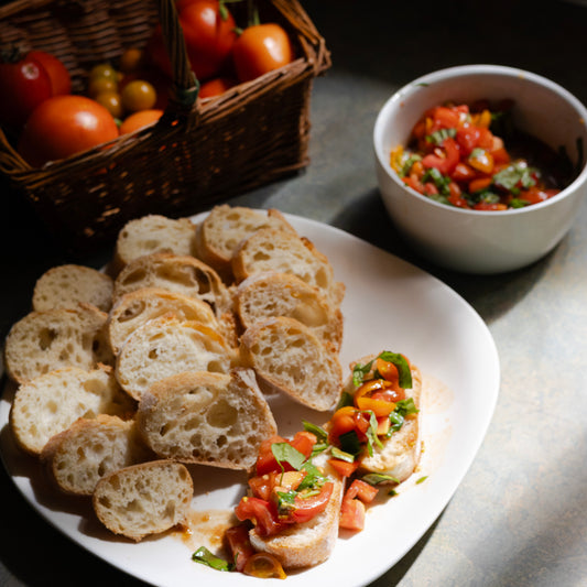 slices of baguette with fresh bruschetta on top