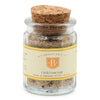 Jar of chili lime salt with cork lid on a white background