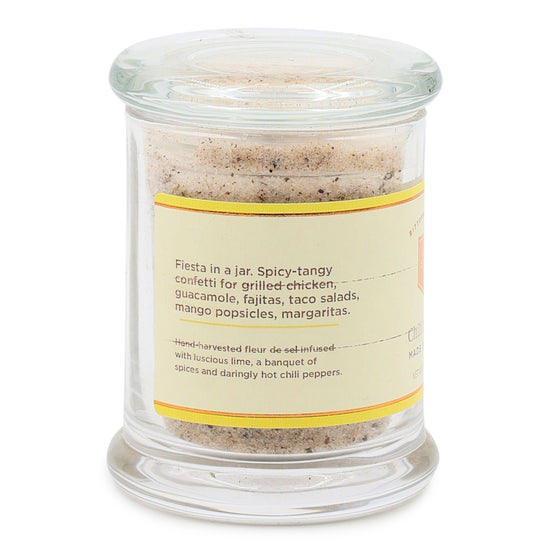 Glass jar with chili lime salt mix and label on a white background