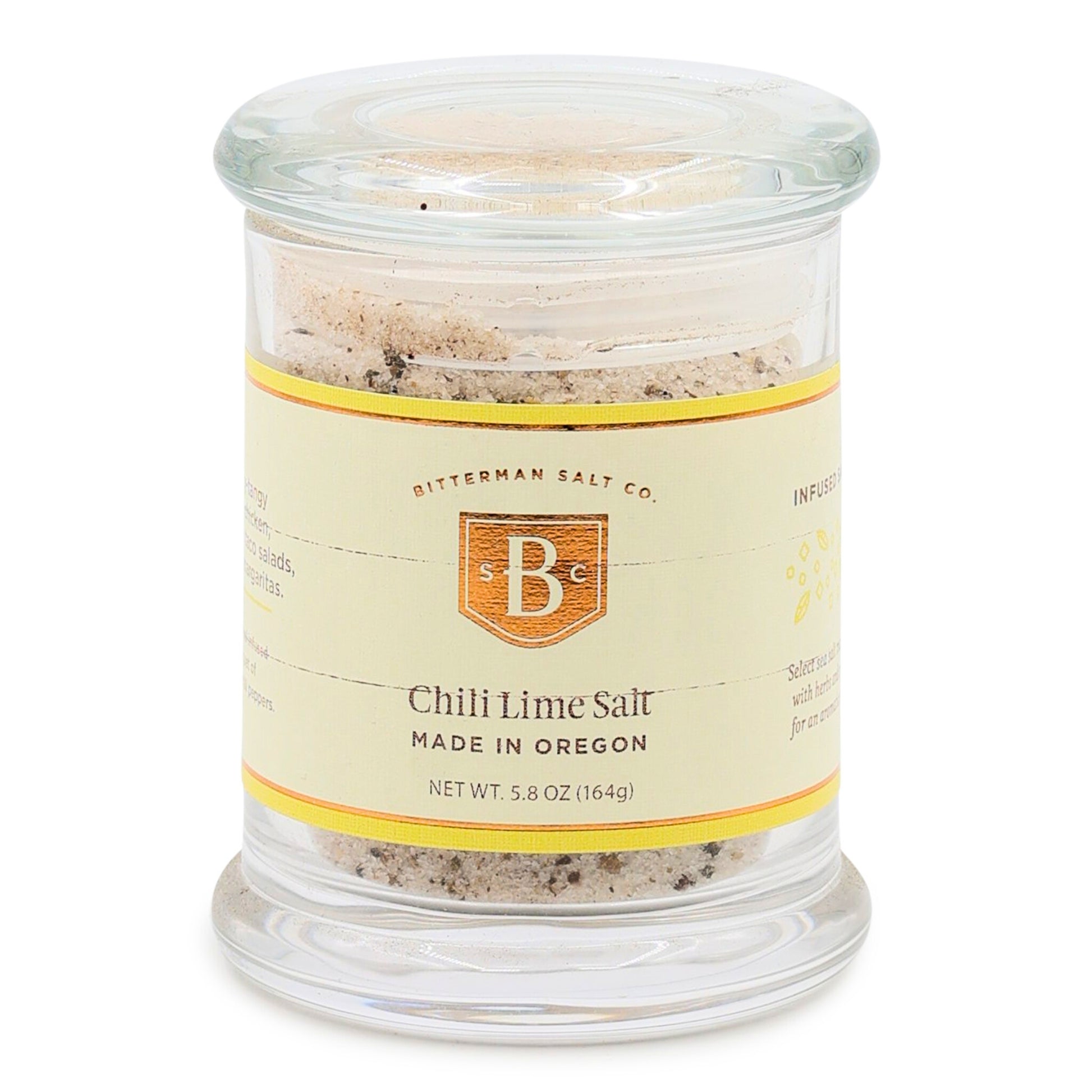 Glass jar of Chili Lime Salt with a label on a white background