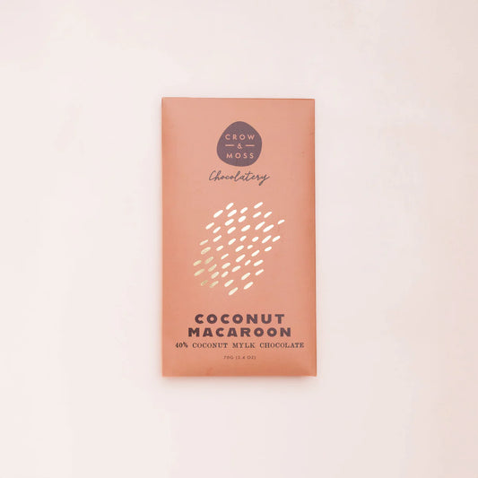 Coconut Macaroon chocolate bar packaging with 'Crow & Moss Chocolatery' branding on a light pink background