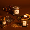 bourbon smoked salt trio on brown background with pecan pie and manhattan