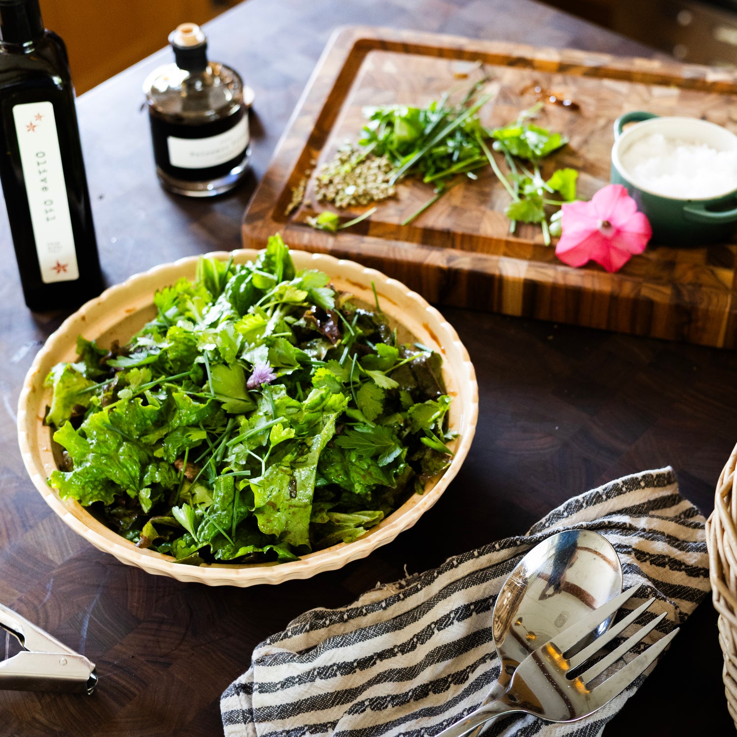 a luscious green salad on a wooden kitchen island