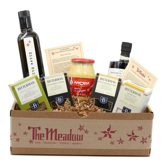 box filled with summer essential pantry products