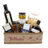 Gift basket from 'The Meadow' with various food items including bottles and jars on a white background.