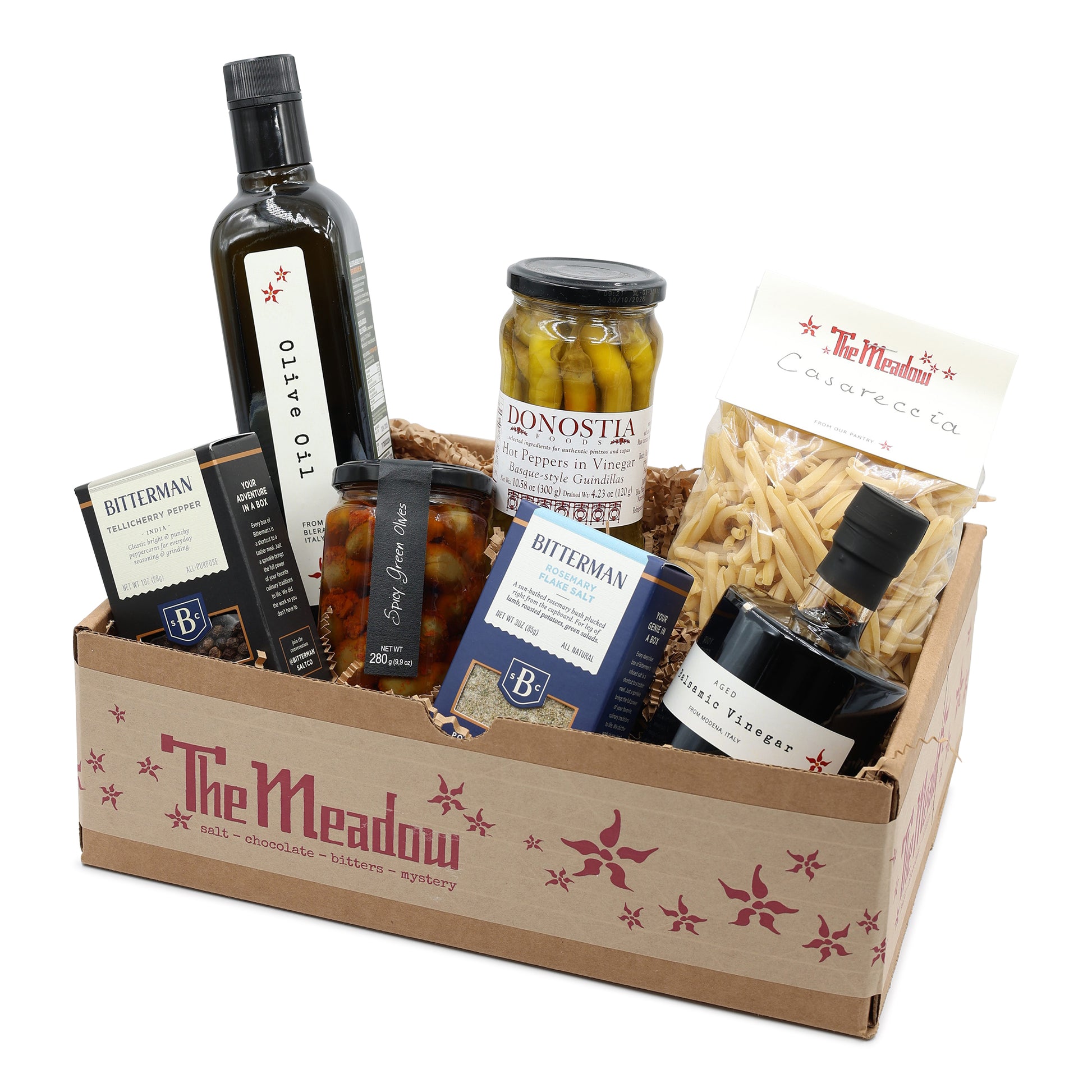 Gift basket from 'The Meadow' with various food items including bottles and jars.