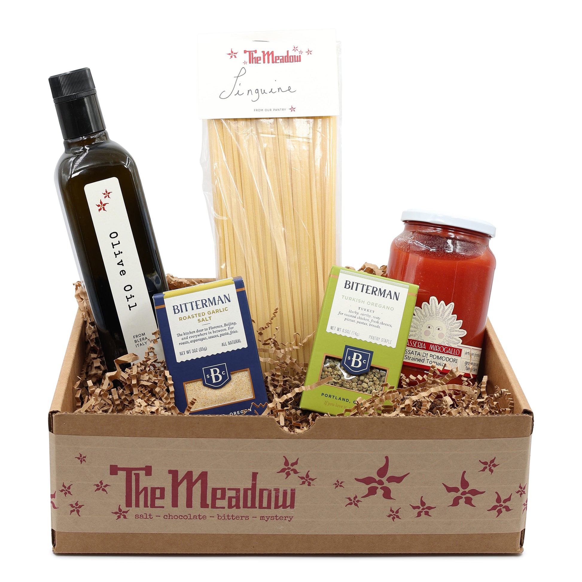 Gift box from 'The Meadow' with olive oil, pasta, and other items.
