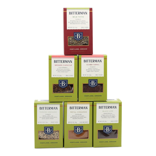 Stack of Bitterman spice boxes on a white background