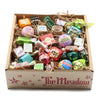 Assorted candies in a box labeled 'The Meadow' on a white background