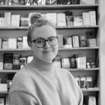 portrait of Amanda in front of chocolate wall