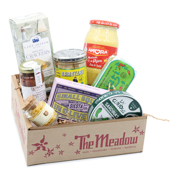 various tinned fish, a small jar of lemon salt, mustard and crackers in a meadow box, tinned fish picnic box