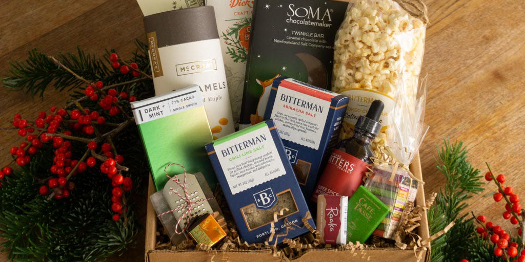 holiday gift box with salts, chocolates, popcorn. stylised with holly berry