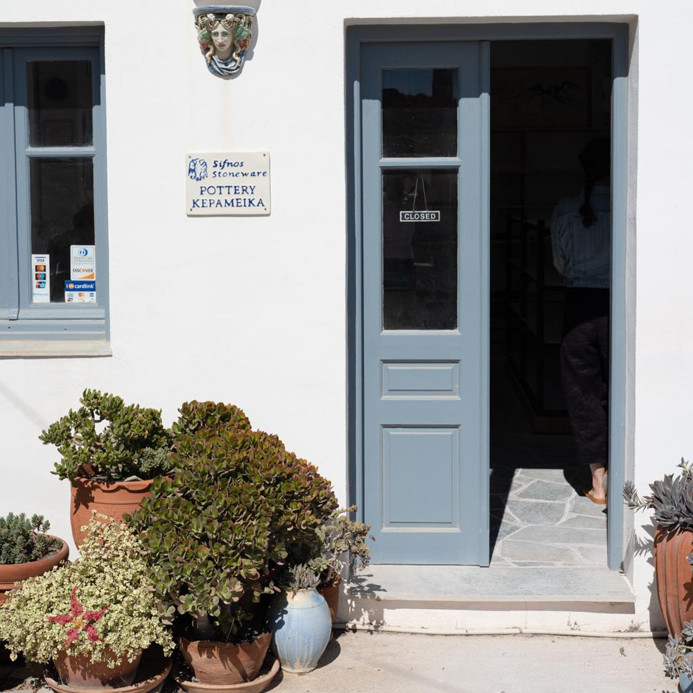 blue door at sifnos stoneware on sifnos island, greece